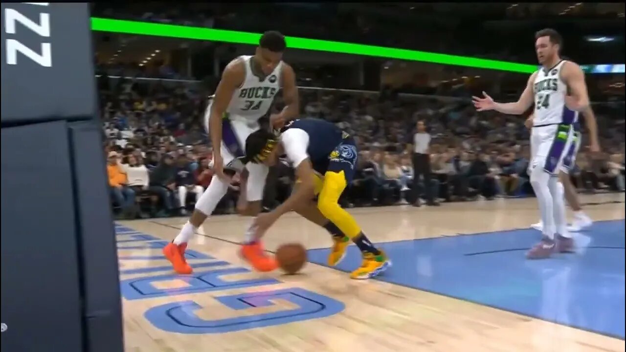 After a hard foul, Giannis receives the award for best sportsmanship from rookie Zaire Williams!