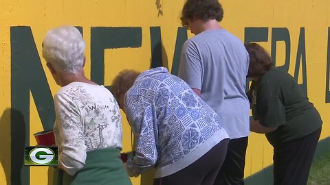 Painting Lambeau Fence