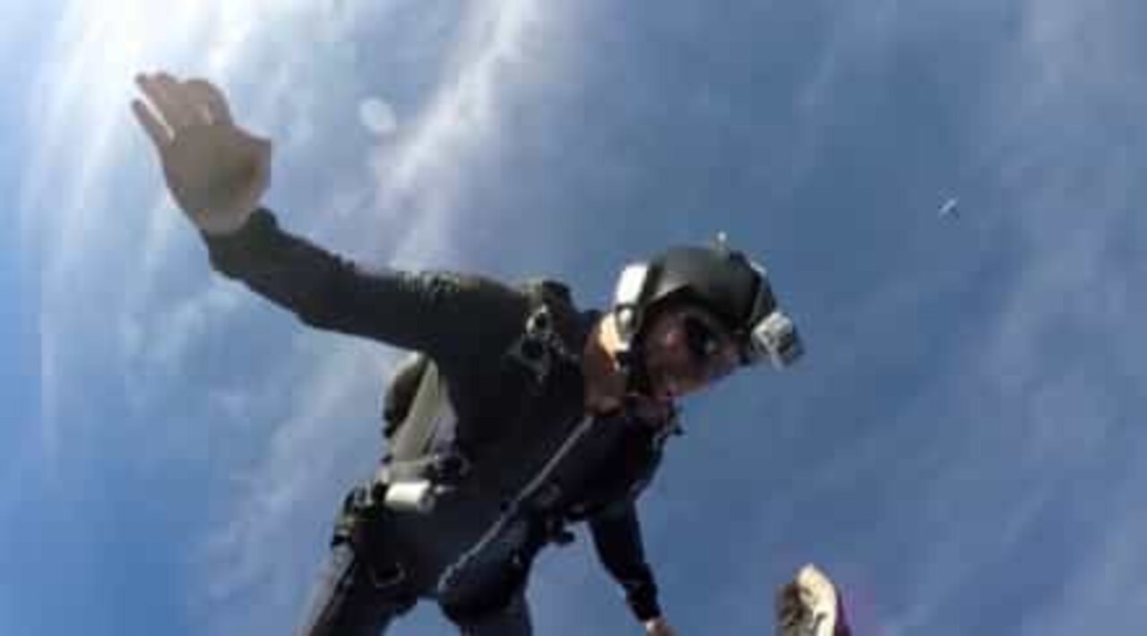 Skydivers high five at 3000 meters!