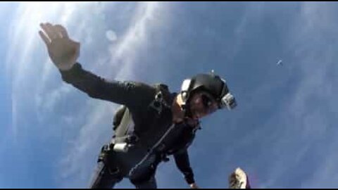 Skydivers high five at 3000 meters!