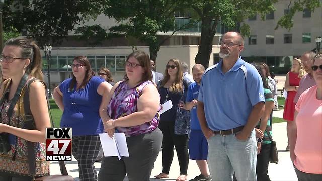 Michigan residents rally against cutting housing funds