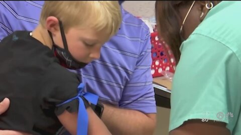 Kids 5 and up get shots in tests for COVID vaccine
