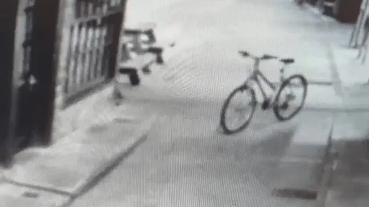 Moment riderless bike rolls across street before falling over in Europe's most haunted city