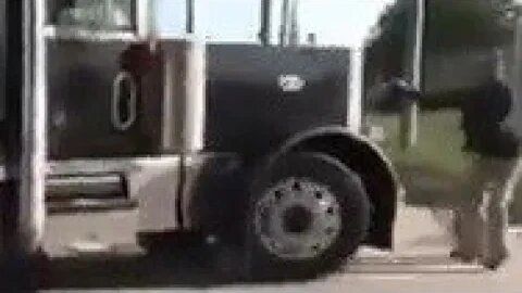 Vegans try to stop a semi-truck