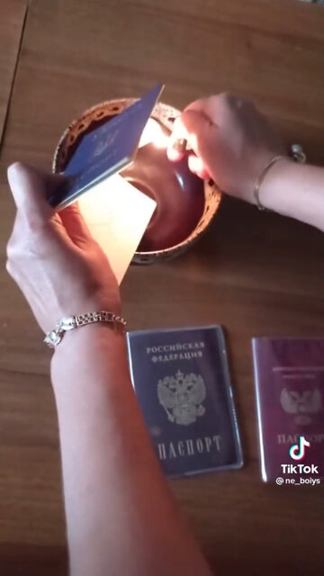 Woman burns her Ukrainian passport