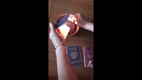 Woman burns her Ukrainian passport