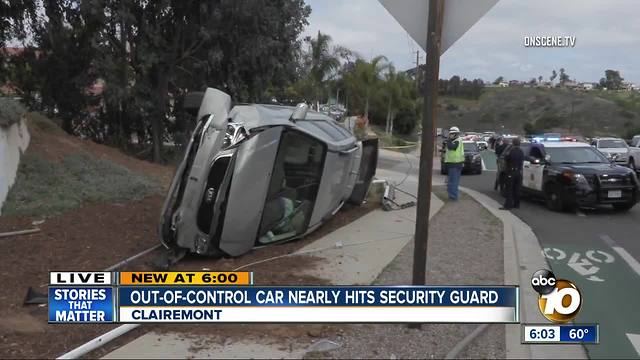 Out-of-control car nearly hits security guard