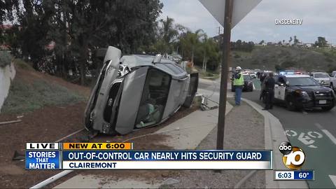 Out-of-control car nearly hits security guard