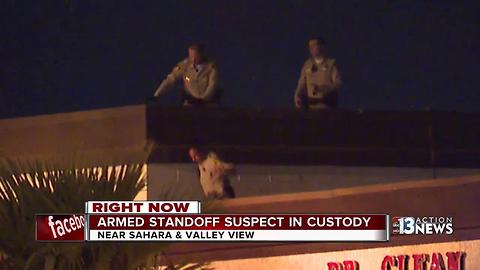 Armed man on roof taken into custody