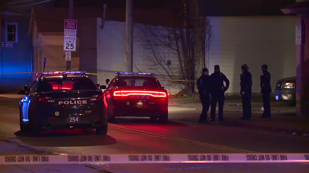 Man in custody after charging at Cleveland police with gun in hand