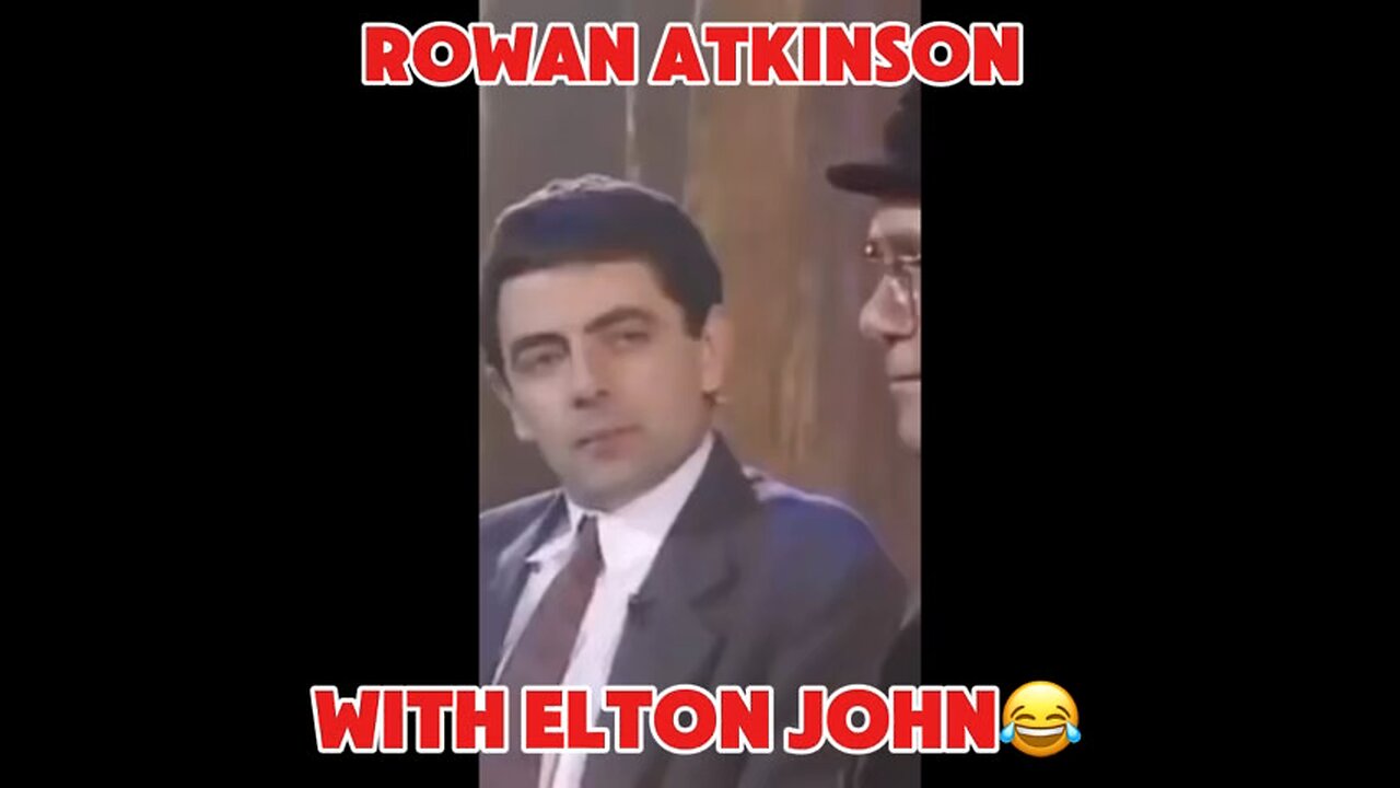 Rowan Atkinson with Elton John