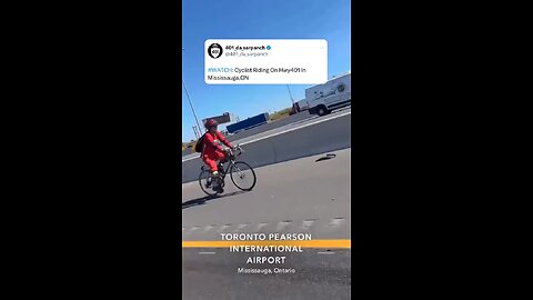 Cyclist riding bike in Highway 401 Toronto