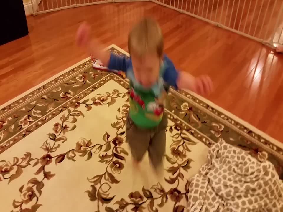 Determined Little Boy Learns how to Hop on One Foot