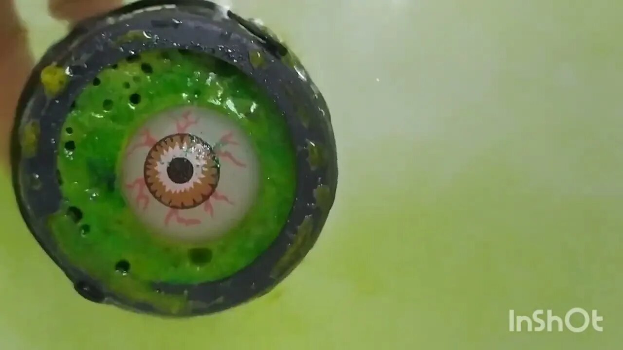 Green creepy eye in witches caldron bath bomb