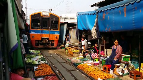 Local Market Runs On Train Track In Thailand Country.