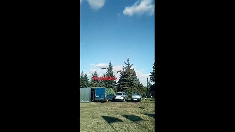 A pair of Su-25SMs fly by at low altitude in Donbass