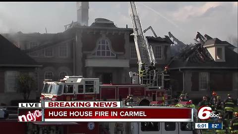 Firefighters fight winds to battle blaze at large home in Carmel subdivision