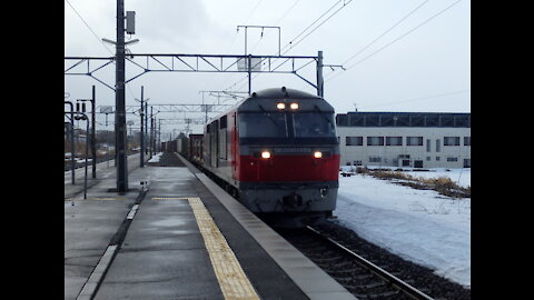 Freight train passing Nanae