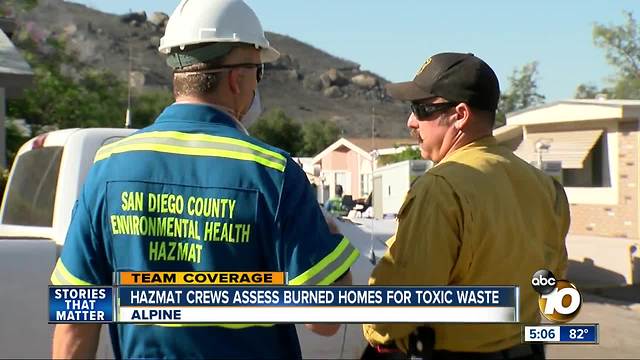 Hazmat crews assess burned homes for toxic waste