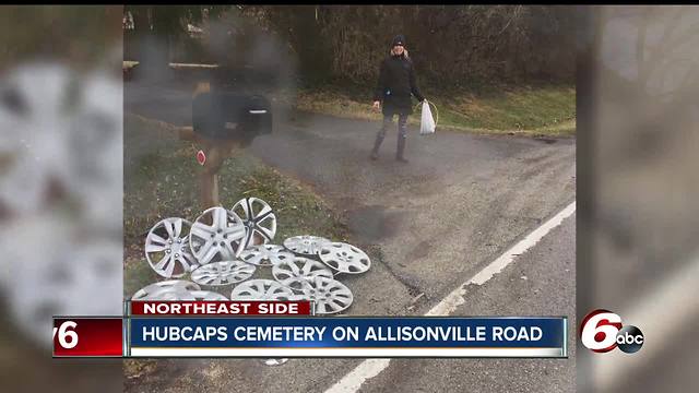 Indy couple's yard becomes 'hubcap cemetery' because of potholes near their home