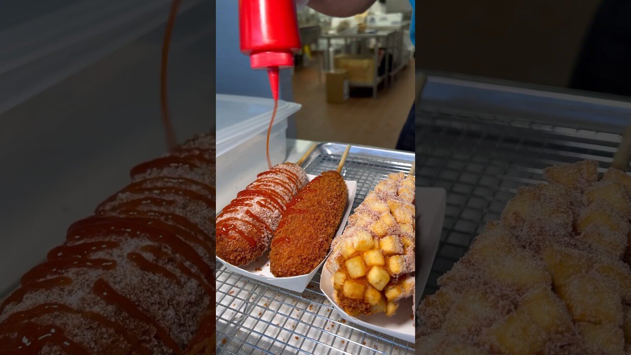 Would you try a KOREAN CORN DOG rolled in sugar with ketchup? 🍢