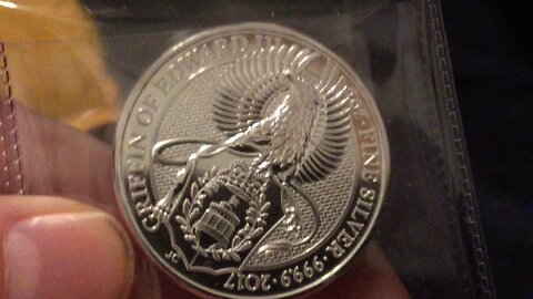 A Silver Dragon Between Two Griffins
