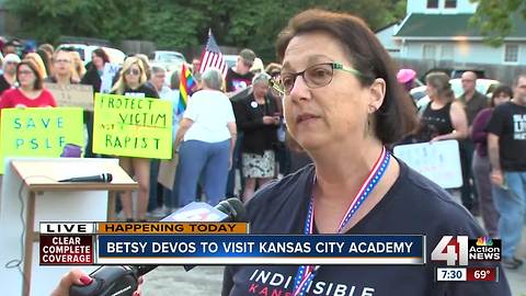 Protesters gather as Betsy DeVos plans to visit KC Academy