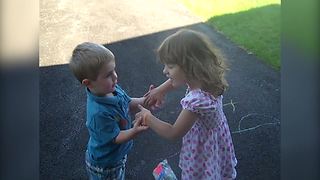 A Tot Girl And A Tot Boy Pretend To Marry Each Other