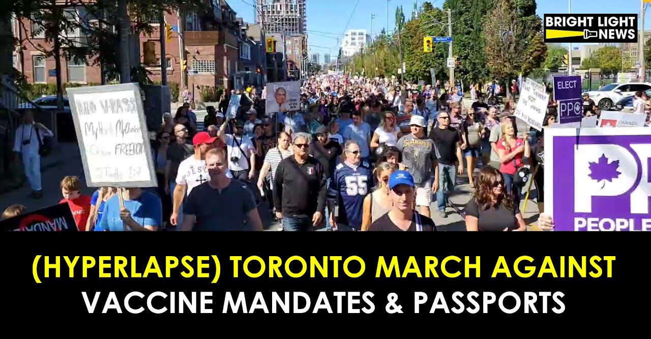 (HYPERLAPSE) TORONTO PROTESTERS MARCH AGAINST VACCINE MANDATES & PASSPORTS