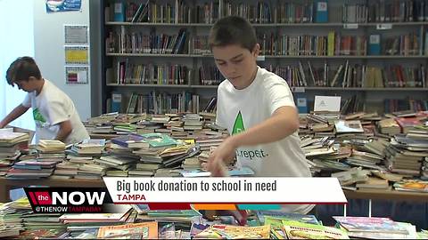 Kids helping kids with big book donation