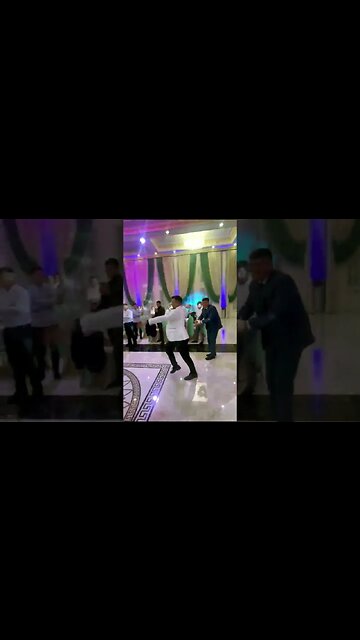 Учителя танцев танцуют на свадьбе лезгинку.