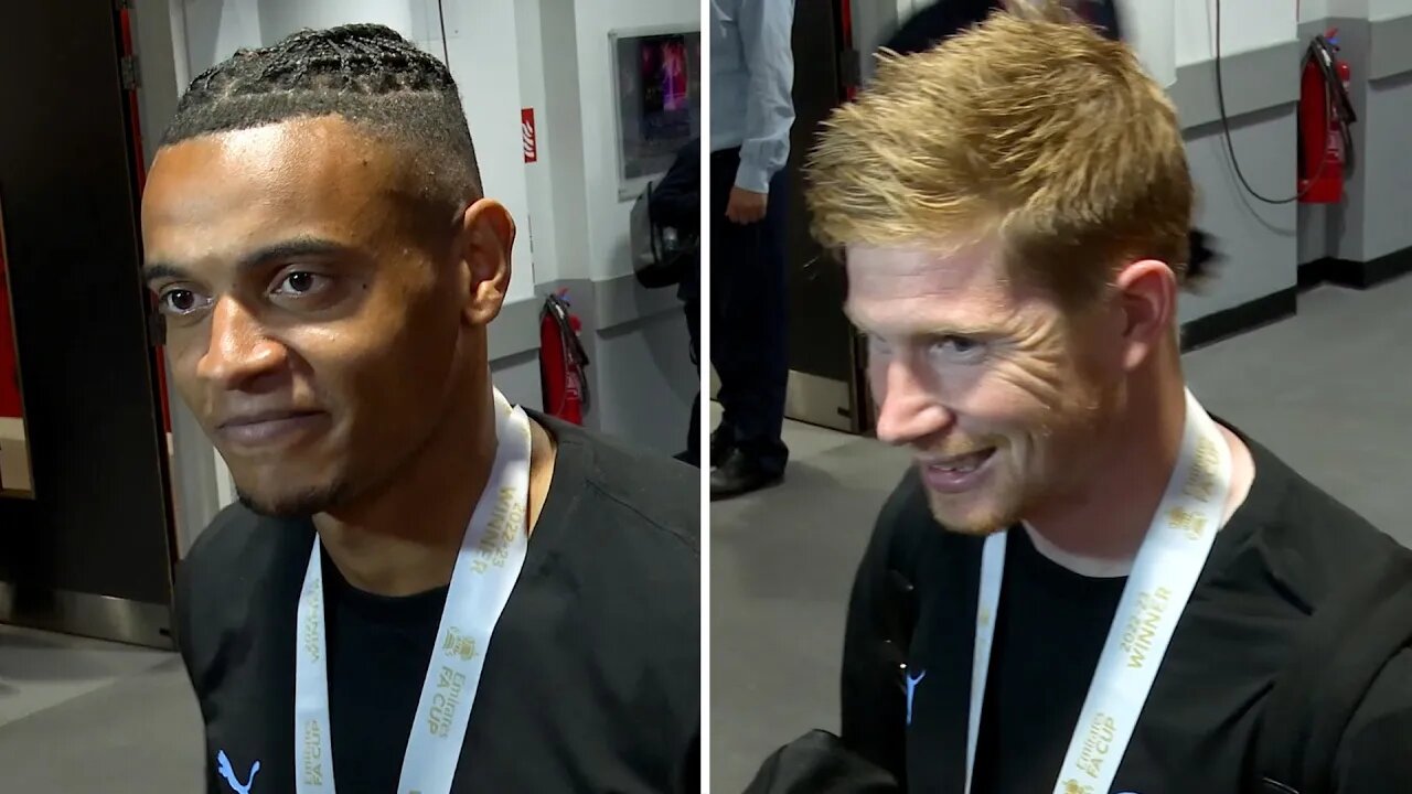 Man City’s Manuel Akanji and Kevin De Bruyne speak after winning the FA Cup