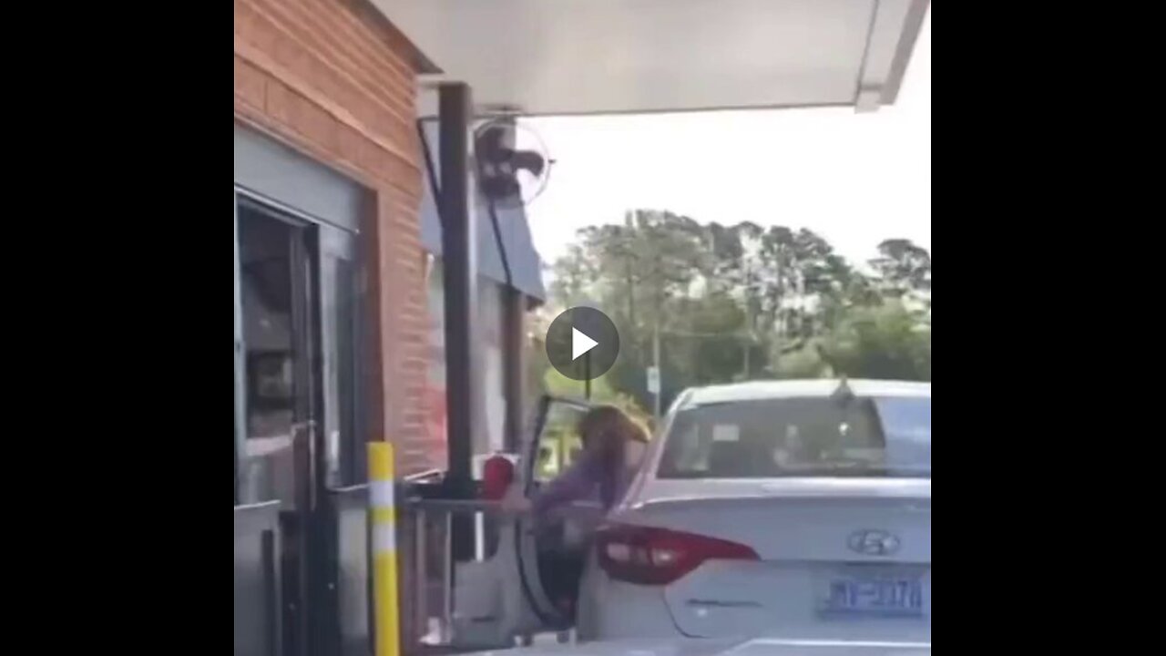 Woman confronts Chick-fil-A staff after leaving her car.