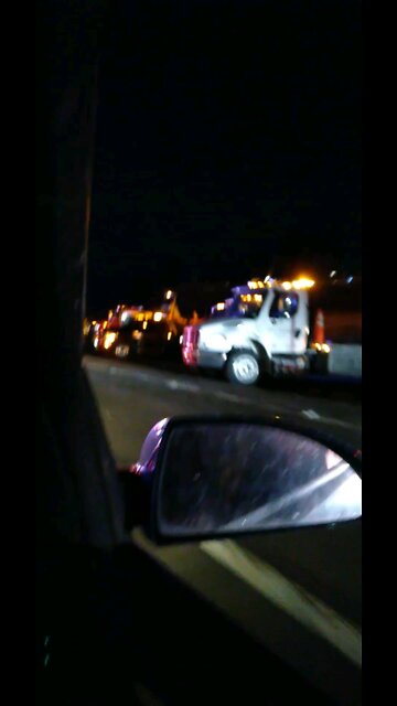 Tow truck driver's showing respect for a fellow fallen tow truck driver who passed away