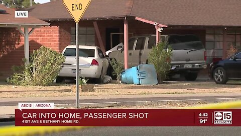 FD: Woman seriously injured after shooting, being in vehicle that crashed into Phoenix home