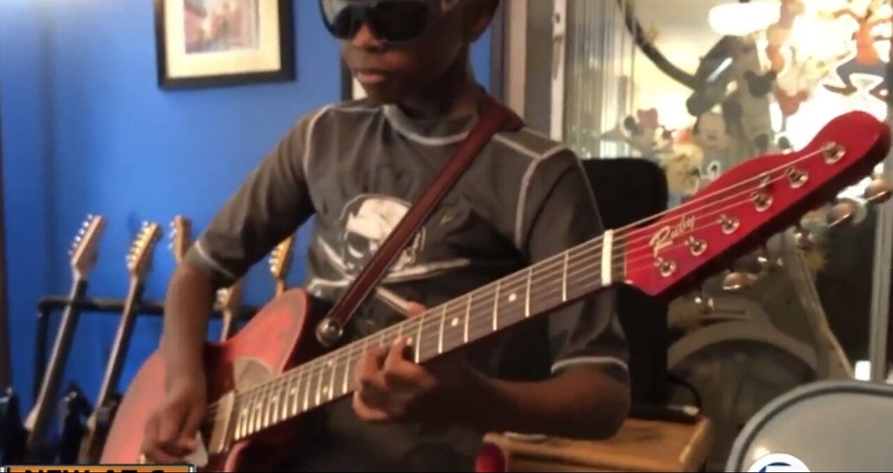 9-year-old guitar prodigy pays it forward