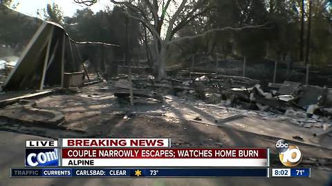 Couple narrowly escapes Alpine fire; Watches home burn