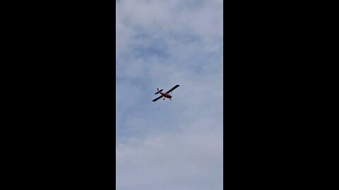 Small plane glides over the lake