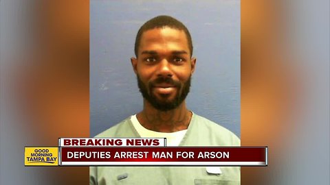 Man arrested in triple homicide arson case; search for second suspect continues