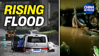 Chinese residents struggle in rising flood water; Soldiers blast dam in China breached by rain