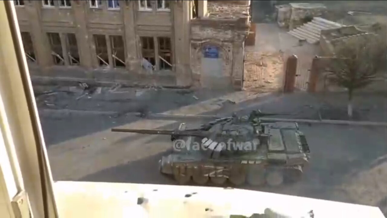 Russian tank takes AT from building.