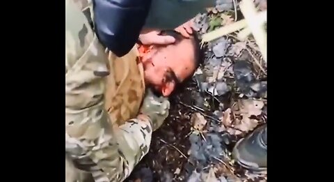 Warning! Graphic Content- Russian forces cut off the ear of a captured terrorist