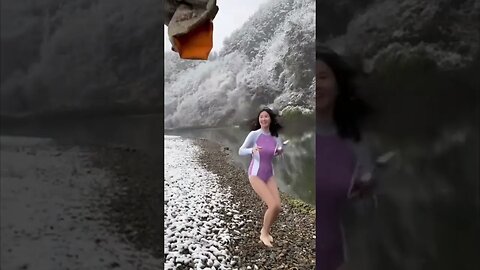 Crazy Chinese Girl Prepares To Jump Into A Freezing Lake