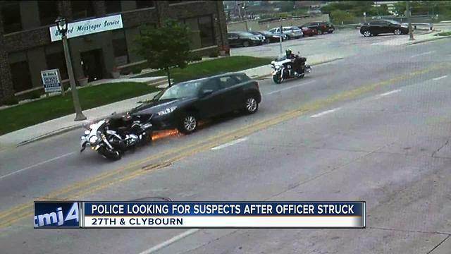 Police looking for suspects after officer injured in hit-and-run