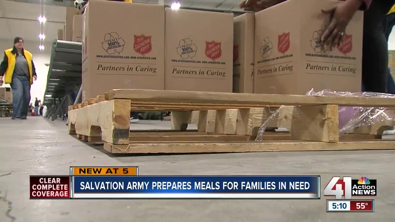 Salvation Army volunteers make Christmas meal kits for families