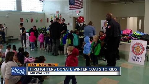 Firefighters donate winter coats to kids