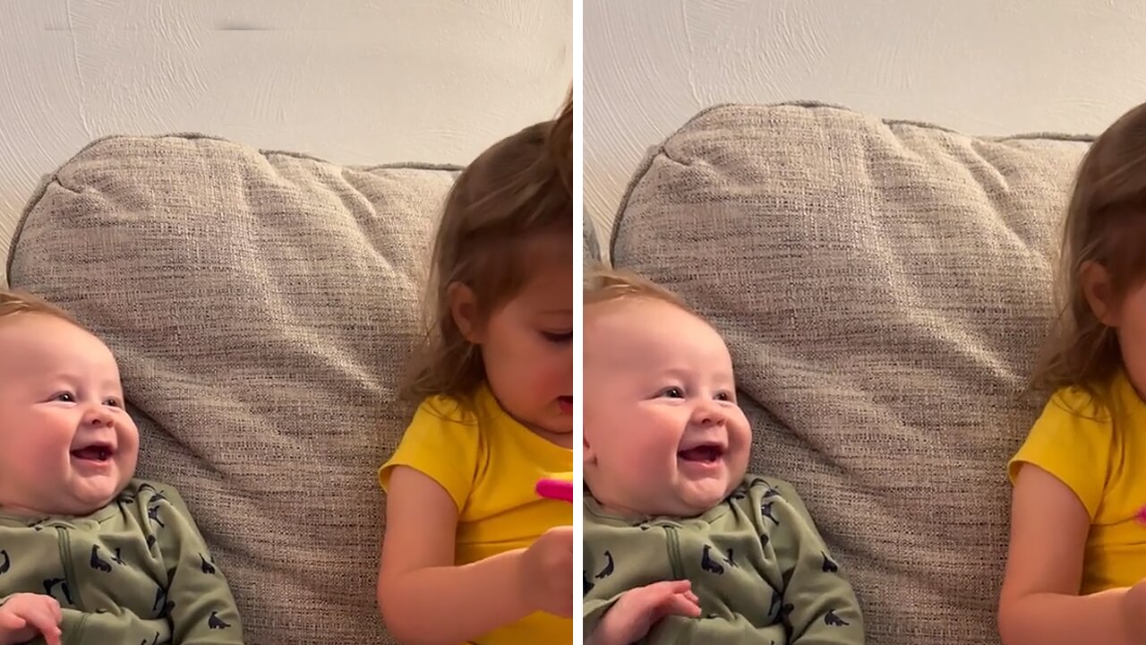 Baby boy preciously smiles at his big sister