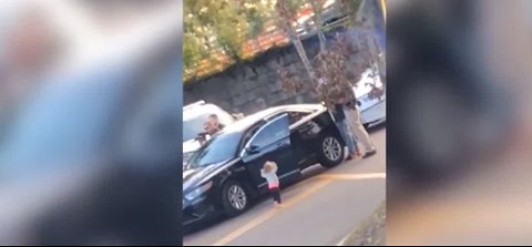 Little girl puts hands up during arrest