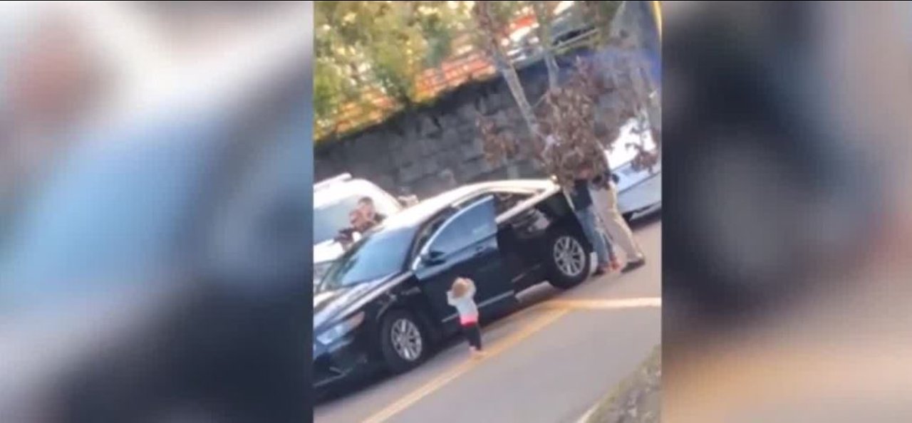 Little girl puts hands up during arrest