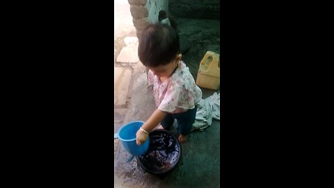 My daughter washing my cloth